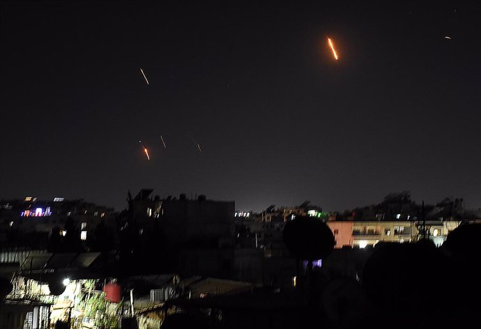 DAMASCUS, June 13, 2025  -- Traces of Iranian missiles heading toward Israel are seen over Damascus, Syria, on June 13, 2025. Dozens of missiles were fired from Iran into Israel on Friday evening, according to statements issued by the Israel Defense Force
