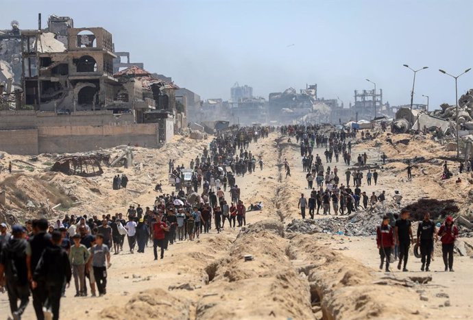 GAZA, June 13, 2025  -- Palestinians are seen in the Sudaniya area, northern Gaza City, on June 12, 2025. The head of the United Nations agency for Palestinian refugees on Thursday condemned the current mechanisms for delivering humanitarian aid in the Ga