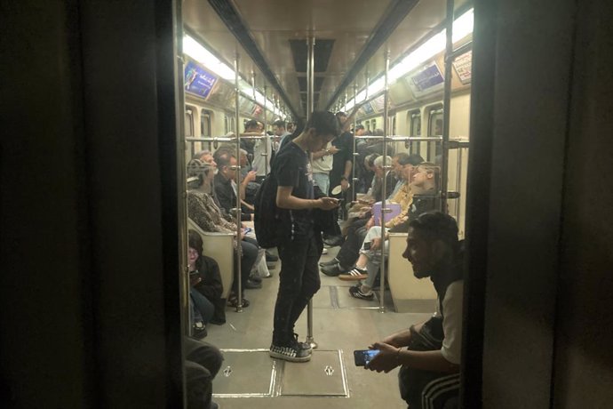 Archivo - May 6, 2024, Tehran, Iran: Commuters travel in a metro train in Tehran.
