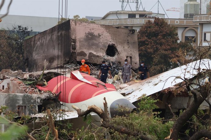 June 14, 2025, Ahmedabad, Gujrat, India: Investigators at the scene as a crane retrieves part of the fuselage of the Air India Boeing 787 on June 14, 2025 in Ahmedabad, India. An Air India Boeing 787 Dreamliner, flight AI-171, carrying 242 passengers and 