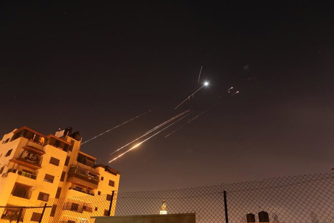 HEBRON, June 16, 2025  -- Missile traces are seen from the city of Hebron in the southern West Bank, during Iran's missile attack against Israel, on June 16, 2025.,Image: 1011368431, License: Rights-managed, Restrictions: , Model Release: no, Credit line: