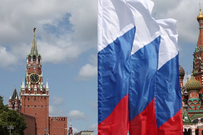 RUSSIA, MOSCOW - JUNE 10, 2025: A view of Russian national flags on Bolshoi Moskvoretsky Bridge in run up to Russia Day. Seen at left is Spasskaya Tower of the Moscow Kremlin