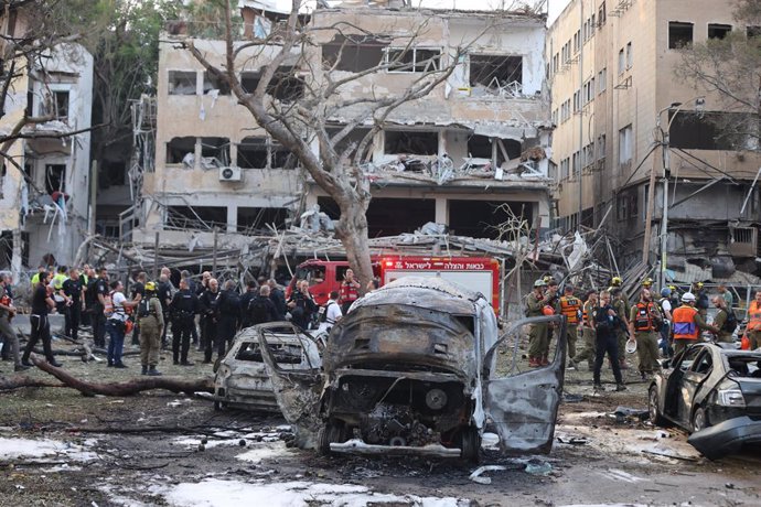 TEL AVIV, June 16, 2025  -- Israeli security and rescue forces work at the scene of a missile attack from Iran in Tel Aviv, central Israel, on June 16, 2025. Iran has launched missile attacks on multiple targets in Israel since Friday, causing casualties 