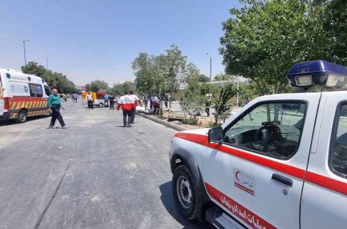 June 15, 2025, Isfahan, Iran: Rescue teams are currently working outside a building that was hit by an Israeli airstrike, amidst escalating retaliatory attacks between the two countries. On June 14, Israel and Iran exchanged fire following an unprecedente