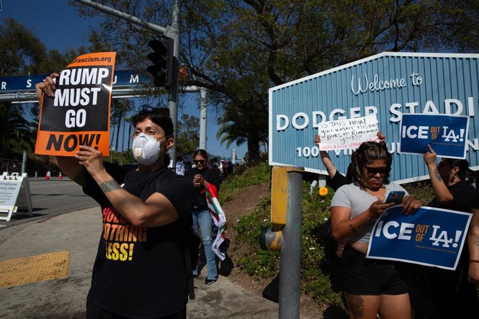 20 June 2025, US, Los Angeles: Demonstrator gather outside the Dodger Stadium to protest the presence of ICE and Border Patrol agents at the stadium parking lot, ahead of the baseball game between the Los Angeles Dodgers and San Diego Padres. Los Angeles.