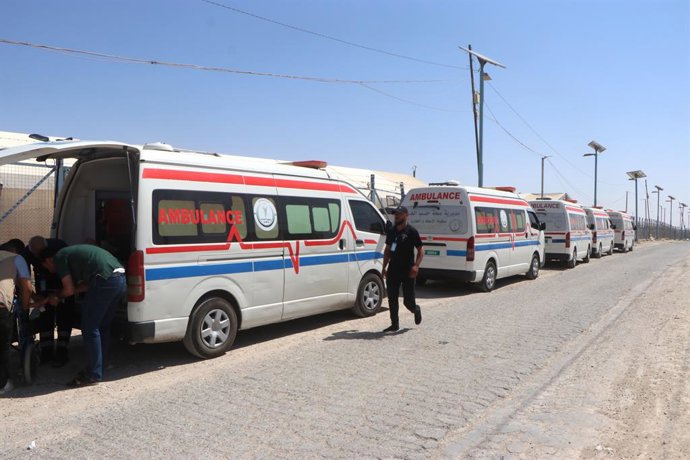 AL-HASAKAH, June 16, 2025  -- Ambulances line outside the Al-Hol camp to assist elderly and ill individuals during the evacuation of the al-Hol camp in Syria's northeastern Al-Hasakah province, on June 15, 2025.   Dozens of displaced Syrian families depar