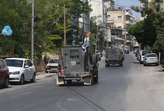 June 10, 2025, Nablus, West Bank, Palestinian Territory: Israeli soldiers take aim during a raid in the old town of Nablus city in the occupied West Bank on June 10, 2025. Israel has occupied the West Bank since 1967, and violence there has soared since t