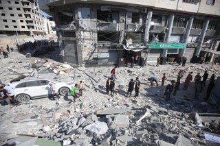 June 27, 2025, Gaza City, Gaza Strip, Palestinian Territory: Palestinians inspect the site of an Israeli air strike on a house in Gaza City, June 27, 2025