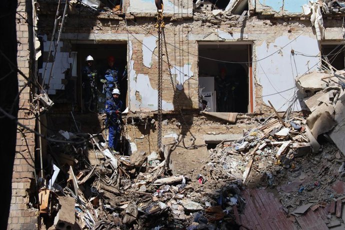 KIEV, June 23, 2025  -- Staff members of the State Service for Emergencies of Ukraine conduct search and clearance operations at the site of an air strike in Kiev, Ukraine, on June 23, 2025. An overnight drone and missile attack by Russia killed at least 
