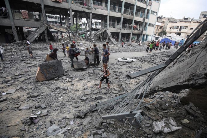 June 30, 2025, Gaza City, Gaza Strip, Palestinian Territory: Palestinian inspect the destruction of the buildings after the Israeli attacks on Al-Falah School, located in the Zaytoun neighborhood in Gaza City, Gaza on June 30, 2025. 