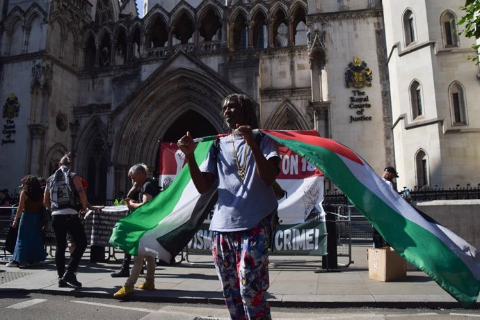July 4, 2025, London, England, United Kingdom: Supporters gather outside the Royal Courts of Justice as Palestine Action launch a legal challenge against the government's decision to ban the activist group.