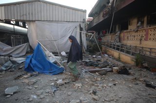 July 3, 2025, Gaza City, Gaza Strip, Palestinian Territory: A view of damage at Mustafa Hafez School and the tents around it following the Israeli attacks in Gaza City, Gaza on July 3, 2025