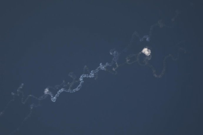 HEBRON, June 11, 2025  -- Missile traces and smoke are seen after Israeli army likely intercepted missiles fired from Yemen, in Hebron, southern West Bank, on June 10, 2025.