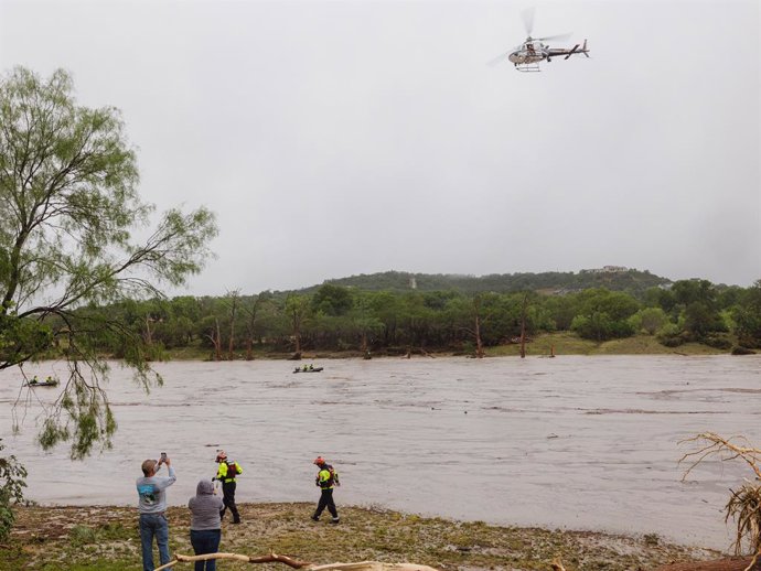 July 4, 2025, Kervrville, Texas, United States: A Texas DPS helicopter conducts arial searches along the Guadalupe River in the wake of a destructive flooding event in Kerrville on Friday July 4, 2025.