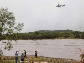 July 4, 2025, Kervrville, Texas, United States: A Texas DPS helicopter conducts arial searches along the Guadalupe River in the wake of a destructive flooding event in Kerrville on Friday July 4, 2025.
