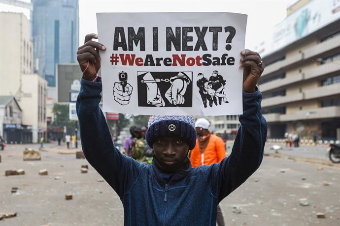 June 25, 2025, Nairobi, Kenya: A protester holds a placard during a protest. The protesters took to the streets, with thousands making their way to the central business district in the capital, Nairobi to mark one year since the anti-tax demonstrations an