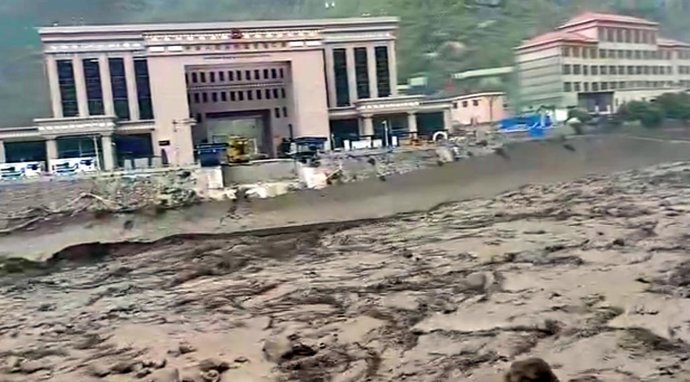 July 8, 2025: Photo taken from social sites shows the flooded river which swept away the Nepal-China Friendship Bridge at Rasuwagadhi border point in Rasuwa, Nepal on July 8,2025. The Nepal-China Friendship Bridge, a key bridge on the trade route between 