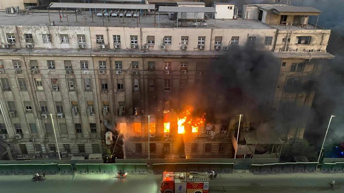 CAIRO, July 7, 2025  -- Firefighters battle a fire at a telecommunication building in Cairo, Egypt, on July 7, 2025. A fire broke out on Monday inside the telecommunication building, injuring 14 people, causing a partial disruption of telecommunication an