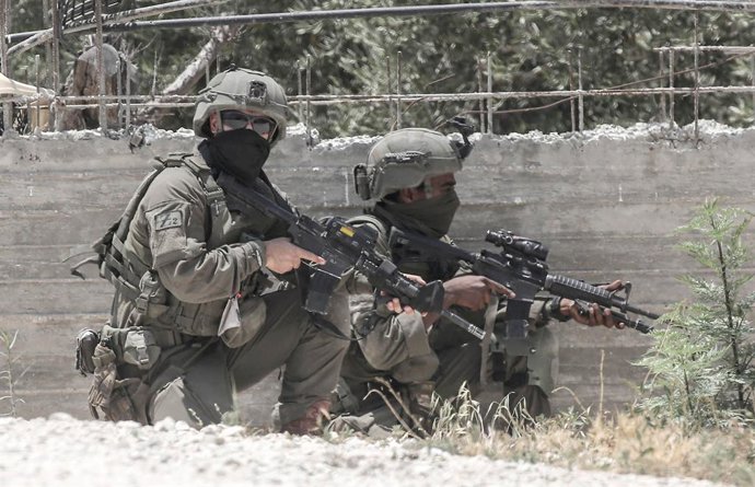 June 17, 2025, Jenin, West Bank, Palestine: Israeli soldiers take up positions in the town of Jaba near the West Bank city, during a military operation. Israeli forces searched homes and neighbourhoods for weapons and they launched a large-scale arrest ca