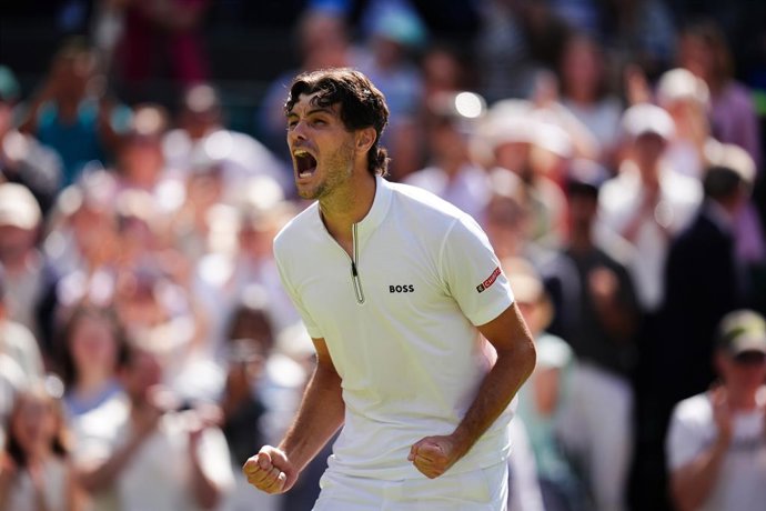 08 July 2025, United Kingdom, London: US tennis player Taylor Fritz  celebrates winning his men's singles quarter-final match against Russia's Karen Khachanov on day nine of the 2025 Wimbledon Championships at the All England Lawn Tennis and Croquet Club.