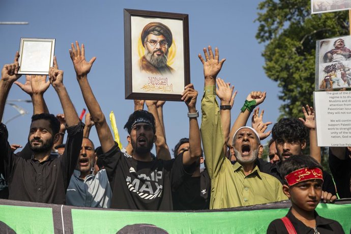 July 5, 2025, Srinagar, Jammu And Kashmir, India: Kashmiri Shiite muslims shout anti-Israel and anti-America slogans as they  hold portraits of late Hezbollah chief Hassan Nasrallah during the eighth day of the Muharram procession in the city center.
