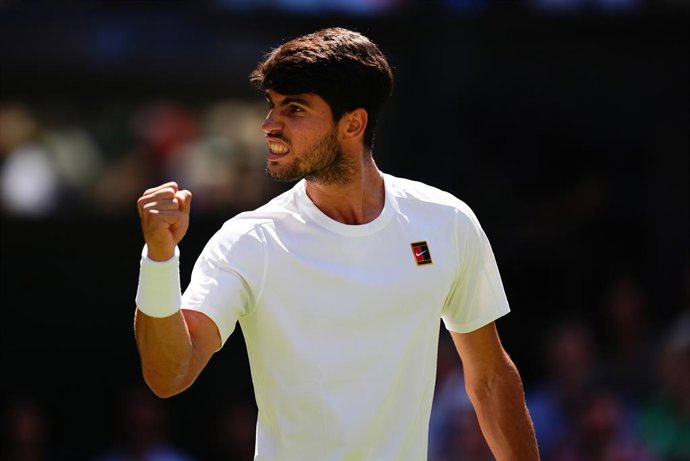 11 July 2025, United Kingdom, London: Spanish tennis player Carlos Alcaraz celebrates a point against US' Taylor Fritz during their men's singles semi final match on day twelve of the 2025 Wimbledon Championships at the All England Lawn Tennis and Croquet