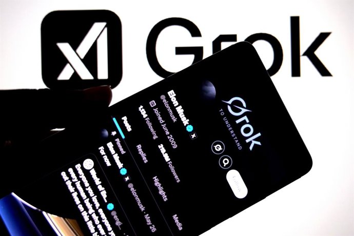 Archivo - May 28, 2025, India: In this photo illustration, an Elon Mask X Profile is seen displayed on a smartphone with the Grok AI logo in the background.