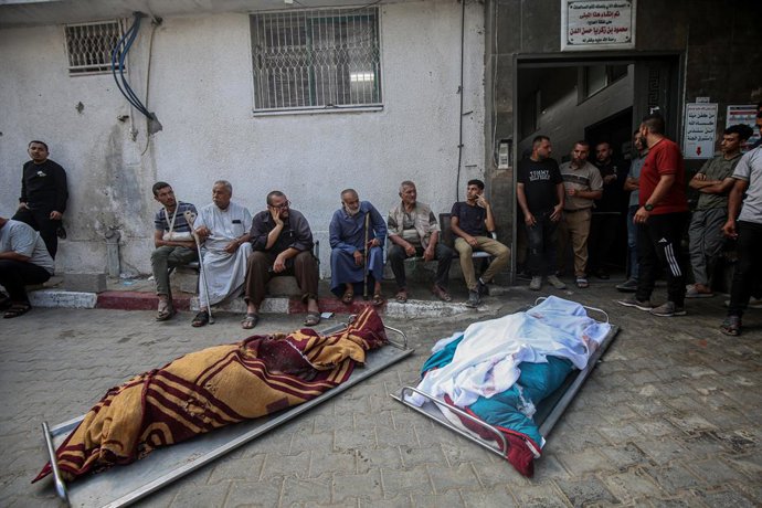 July 11, 2025, Gaza City, Gaza Strip, Palestinian Territory: Mourners carry a bodys as they attend the funeral of Palestinians killed in overnight Israeli strikes, according to medics, at Al-Shifa Hospital in Gaza City, July 11, 2025