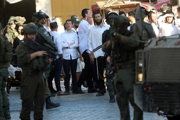 HEBRON, June 29, 2025  -- Members of Israeli forces secure the streets for Israeli settlers in the Old City of Hebron in the southern West Bank, on June 28, 2025.