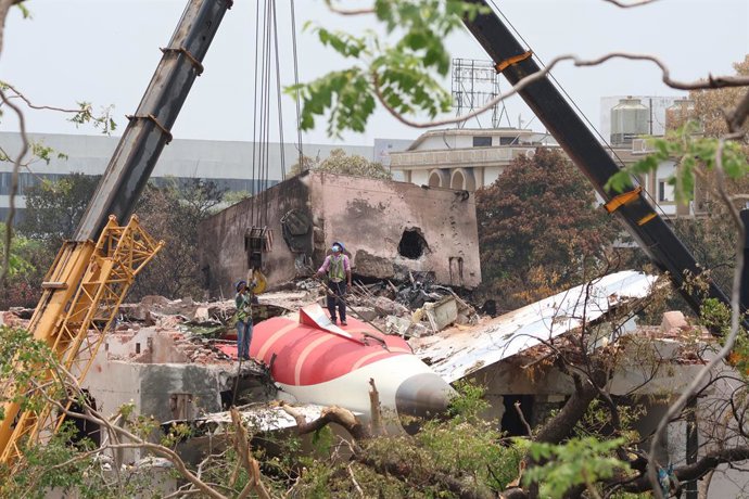 June 14, 2025, Ahmedabad, Gujrat, India: A crane retrieves part of the fuselage of the Air India Boeing 787 on June 14, 2025 in Ahmedabad, India. An Air India Boeing 787 Dreamliner, flight AI-171, carrying 242 passengers and crew members en route from Ahm