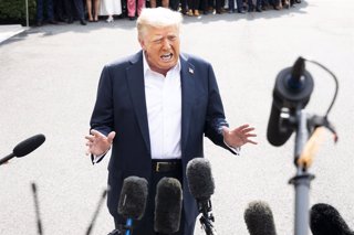 July 11, 2025, Washington, District Of Columbia, USA: President DONALD TRUMP speaking with the press as he is leaving the White House in Washington, D.C.