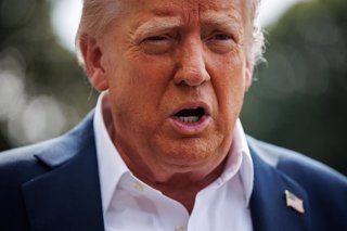 July 11, 2025, Washington, District Of Columbia, USA: United States President Donald J Trump responds to questions from reporters after walking out of the South Portico of the White House to board Marine One on the South Lawn on July 11, 2025 in Washingto