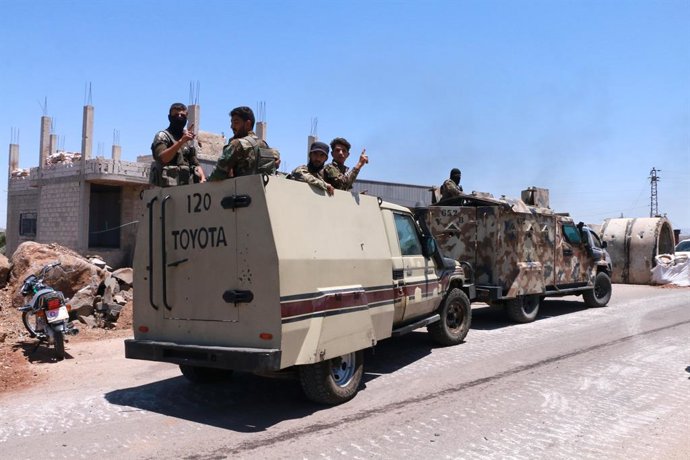 SWEIDA, July 14, 2025  -- Syrian military personnel are seen during deployment in the western countryside of Sweida province, southern Syria, on July 14, 2025. At least 89 people were killed and some 200 others injured over the past two days in escalating