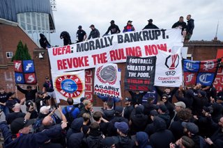 15 July 2025, United Kingdom, London: Crystal Palace fans hold banners and placards during a protest march from Norwood Clocktower to Selhurst Park. Crystal Palace have confirmed they are considering an appeal to the Court of Arbitration for Sport (CAS) a