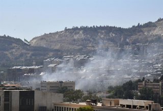 DAMASCUS, July 16, 2025  -- Smoke is seen near the Syrian Army General Command headquarters in Damascus, Syria, on July 16, 2025. Israeli airstrikes hit the Syrian presidential palace area and destroyed parts of the Syrian Army General Command headquarter