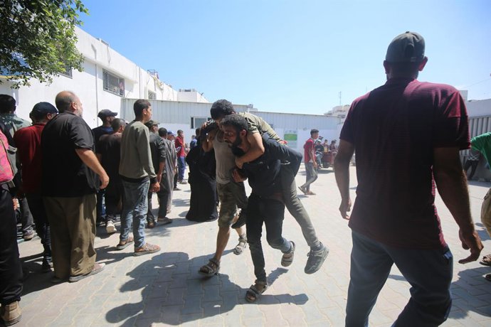 July 20, 2025, Gaza City, Gaza Strip, Palestinian Territory: Injured and bodies were brought to Al-Shifa Hospital in Gaza City after Israeli forces opened fire on civilians who were waiting for humanitarian aid near the Zikim area on the northern Gaza coa