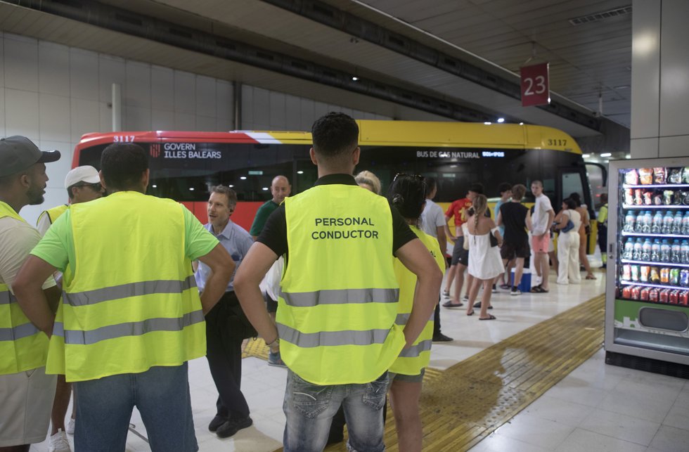 18 July 2025, Spain, Palma: Striking bus drivers and employees of TIB, the Balearic Islands' public transport company, gather at Palma's main bus station on the first day of their walkout.