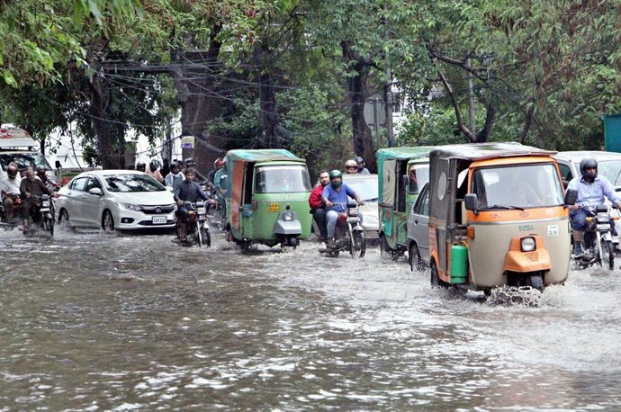 15 July 2025, Pakistan, Lahore: Commuters are facing difficulties in transportation due to stagnant rainwater caused by downpour of monsoon season, showing negligence of concerned authorities, at Shimla Hill in Lahore. Photo: Ppi/PPI via ZUMA Press Wire/d
