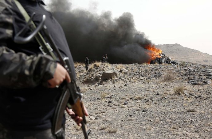 SANAA, July 2, 2025  -- A soldier stands guard as illicit narcotics are being burned near Sanaa, Yemen, on July 1, 2025.   Security forces of Yemen's Houthi group destroyed approximately 19 tons of narcotics, hashish and other illegal drugs here on Tuesda