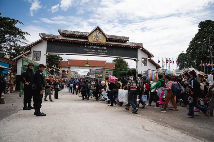 July 28, 2025, Ban Laem, Chanthaburi, Thailand: Cambodians hurry through Ban Laem checkpoint. Thousands of Cambodians returned home through Ban Laem checkpoint  over the weekend as tensions escalated along the Thai-Cambodian border. The movement occurred 