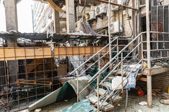 July 4, 2025, Kyiv, Ukraine: Damaged and destroyed buildings in Kyiv are seen following an air strike, showcasing the impact of ongoing conflict. Debris covers the ground alongside twisted metal and shattered structures. On the night of July 4, Russia car