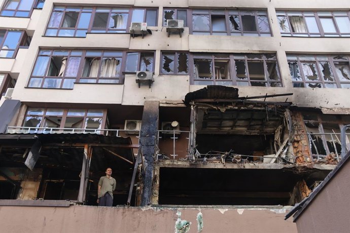 KIEV, July 21, 2025  -- A man stands on the balcony of a damaged residential building in the Shevchenkivskyi district of Kiev, Ukraine, July 21, 2025. Two people were killed and 15 others injured in a wave of Russian missile and drone strikes on Ukraine's