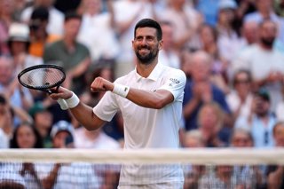 09 July 2025, United Kingdom, London: Serbian tennis player Novak Djokovic celebrates defeating Italian Flavio Cobolli during their men's singles quarter-final match on day ten of the 2025 Wimbledon Championships at the All England Lawn Tennis and Croquet