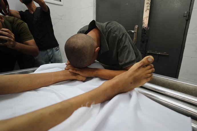 August 2, 2025, Gaza City, Gaza Strip, Palestinian Territory: Body of 17-year-old boy named Atif Ebu KHatir, who lost his live due to malnutrition, seen being taken from Al-Shifa Hospital in Gaza City, Gaza on August 2, 2025