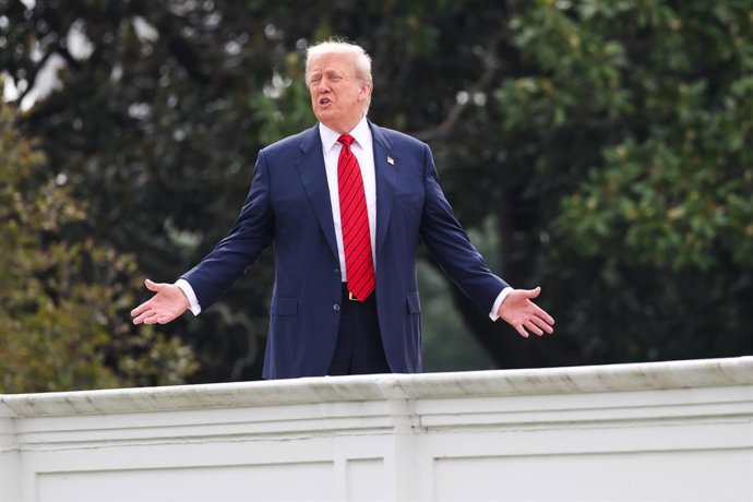 August 5, 2025, Washington, District Of Columbia, USA: United States President Donald J Trump gestures to the media from the roof of the West Wing at the White House on August 5, 2025 in Washington, D.C