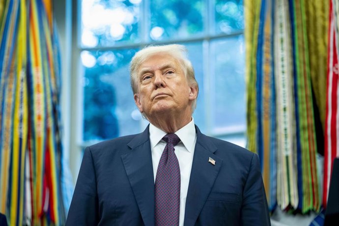 August 6, 2025, Washington, District Of Columbia, USA: United States President Donald J Trump looks on after announcing an additional 00 billion Apple investment in the US, which now will total over 00 billion over the next four years, in the Oval Office 