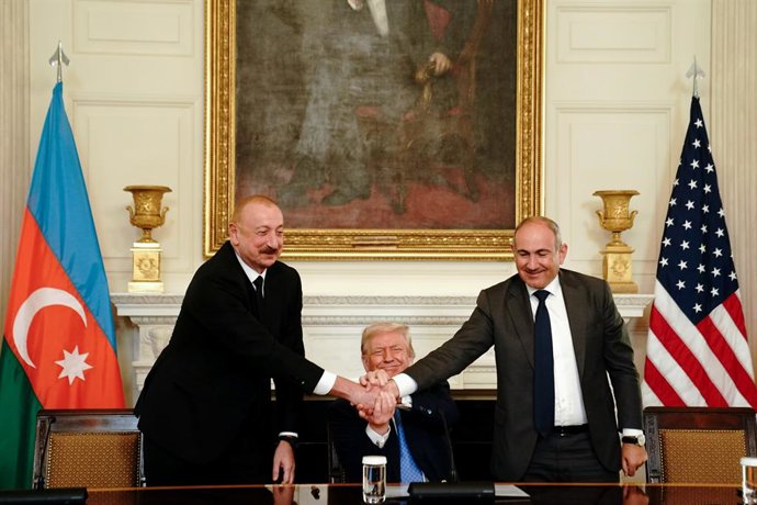 August 8, 2025, Washington, District Of Columbia, USA: Ilham Aliyev, Azerbaijan's president, from left, US President Donald Trump, and Nikol Pashinyan, Armenia's prime minister, shake hands during a signing ceremony in the State Dining Room of the White H