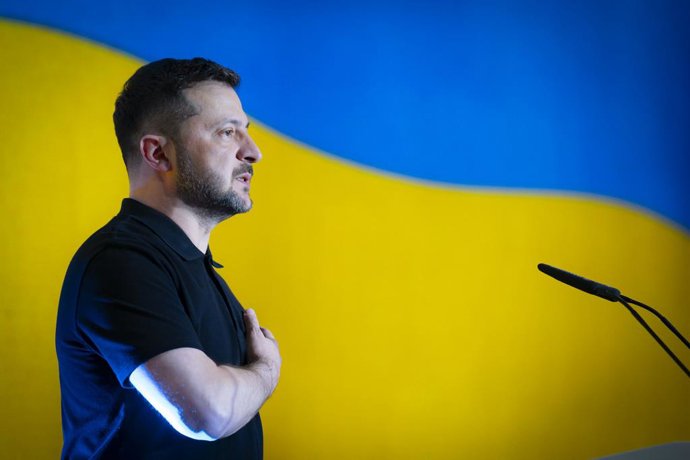 August 12, 2025, Kiev, Sumy Oblast, Ukraine: Ukrainian President Volodymyr Zelenskyy, stands for the national anthem before delivers remarks to young people gathered for the annual Ukrainian Youth Forum held to mark Youth Day, August 12, 2025 in Kiev, Ukr