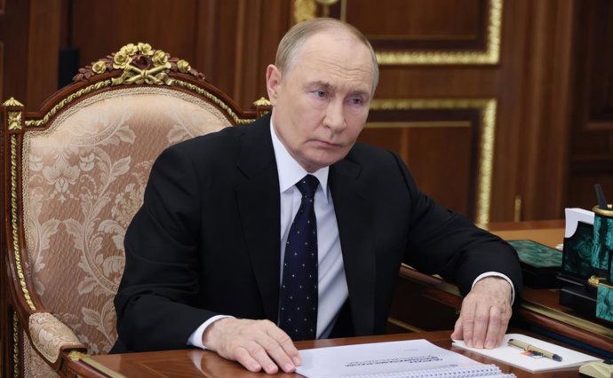 August 13, 2025, Moscow, Moscow Oblast, Russia: Russian President Vladimir Putin, listens to Federal Taxation Service Commissioner Daniil Yegorov, right, deliver his report during a face-to-face meeting at the Kremlin, August 13, 2025 in Moscow, Russia.