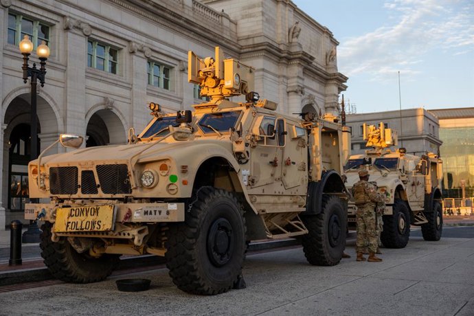 14 August 2025, US, Washington: Armored vehicles of the DC National Guard's 372nd Military Police Battalion are parked in front of Union Station in Washington, DC, as part of the Trump administration's deployment of National Guard troops in the district. 